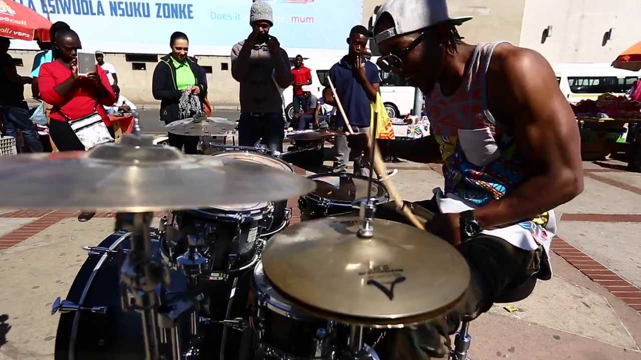Drummer J-Star shows kids how to beat the streets