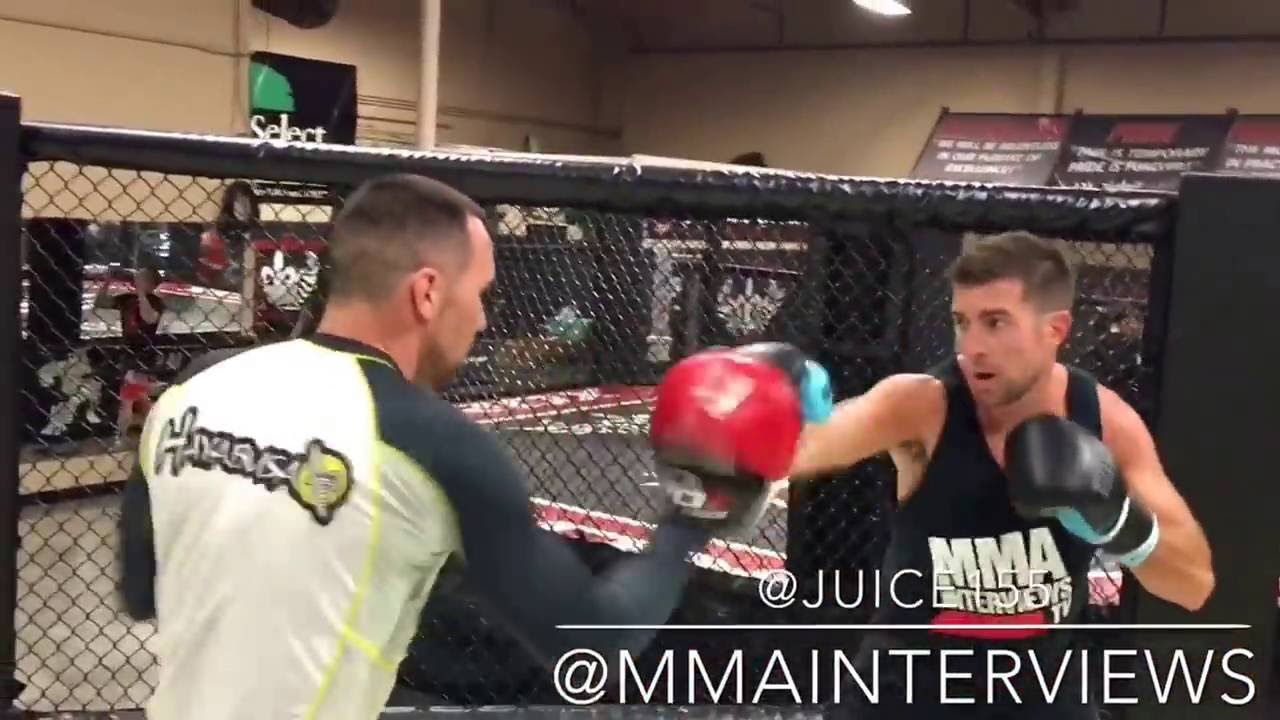 Zach Juusola works boxing mits with Spencer Lazara at Xtreme Couture