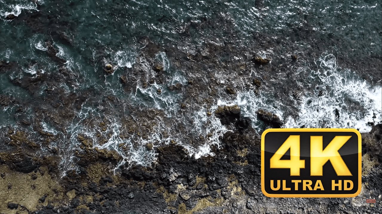 Waves Crashing Rocks 4K Stock Footage Clip