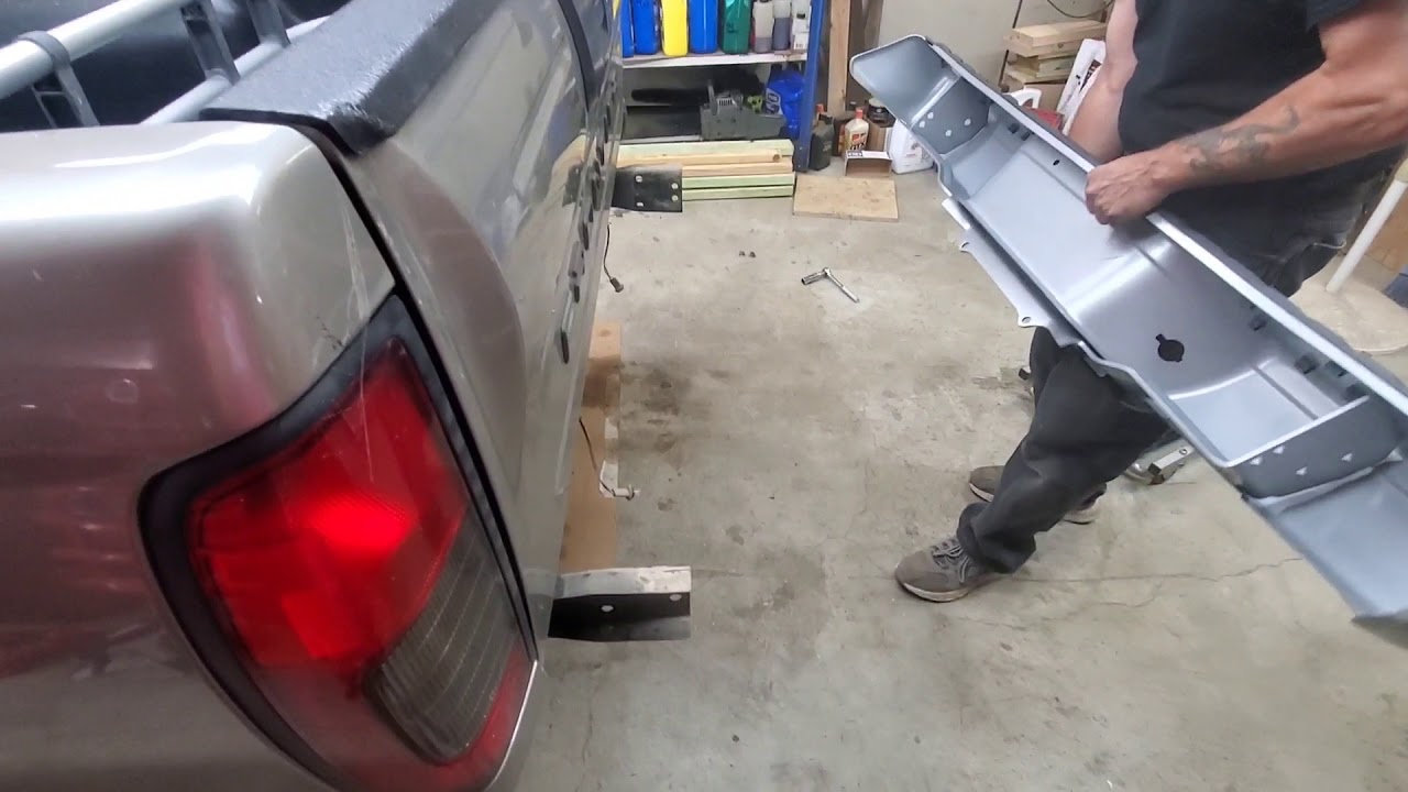 Replacing the rear bumper on a Nissan frontier.