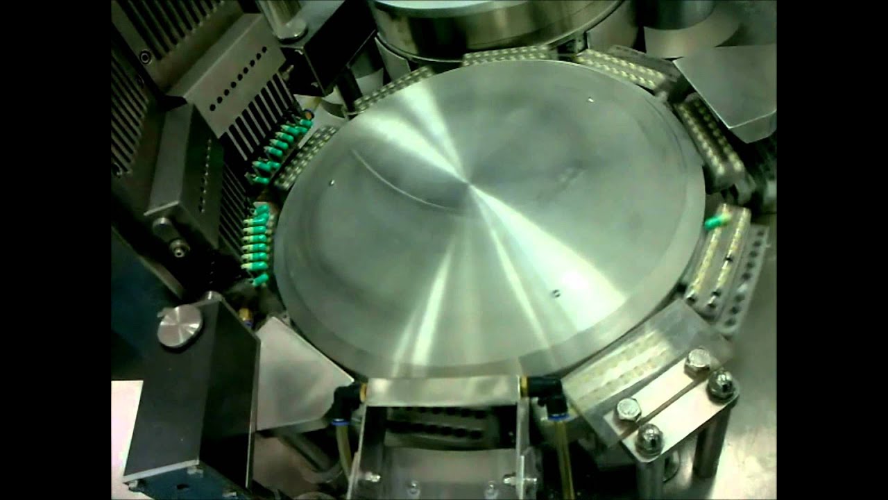 AUTOMATIC CAPSULE FILLING MACHINE.wmv