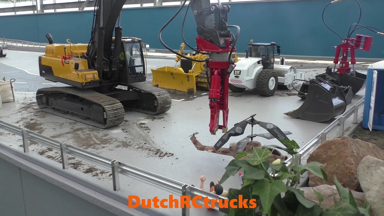 Demolishing a RC Helicopter with an Excavator and some WEDICO Trucks