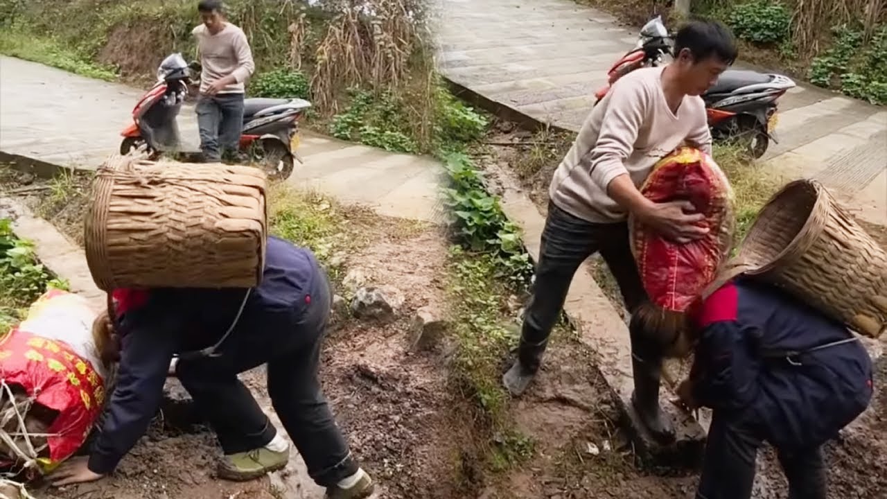 A beautiful woman fell while carrying goods uphill, and a kind-hearted man helped her.