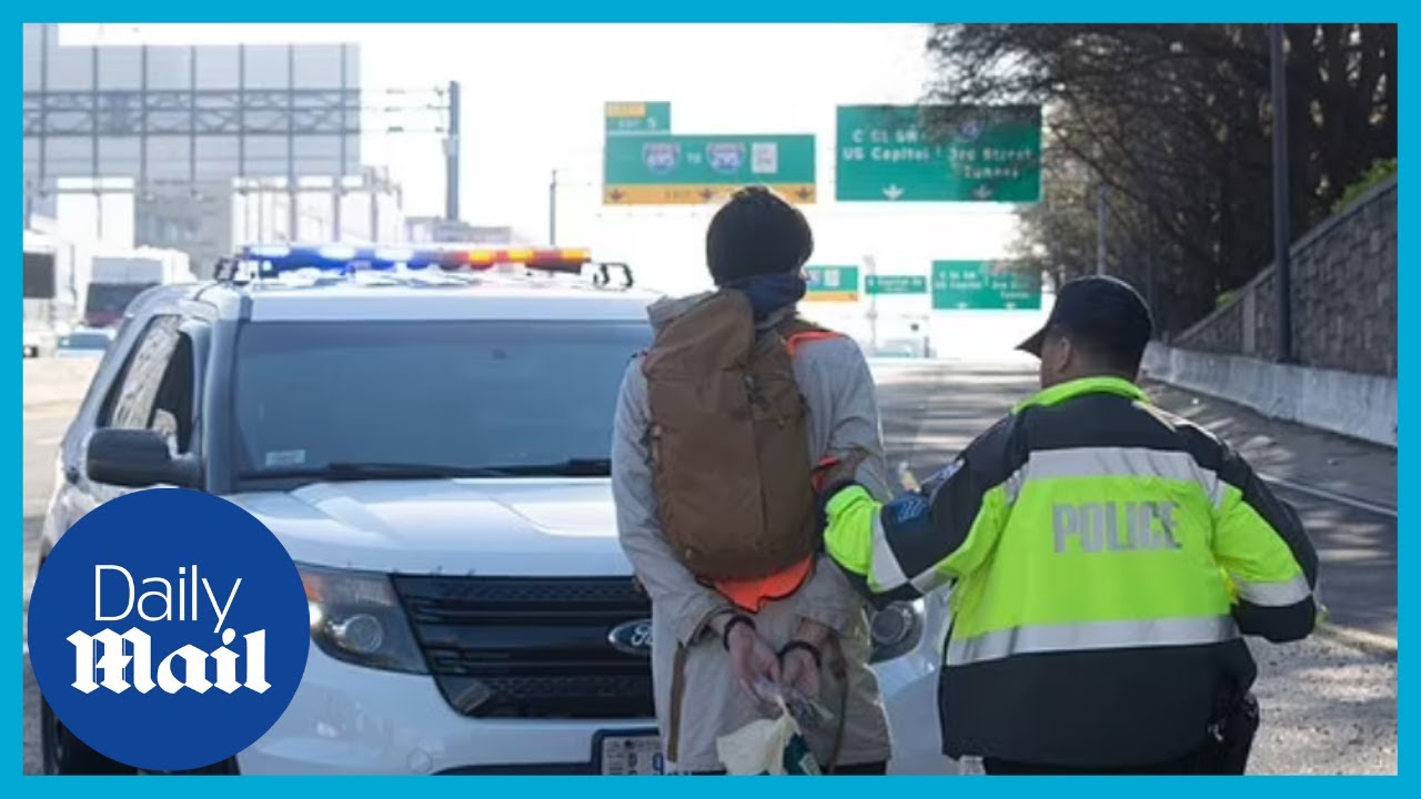 Protester arrested: Climate activists block traffic on the I-395 going into DC