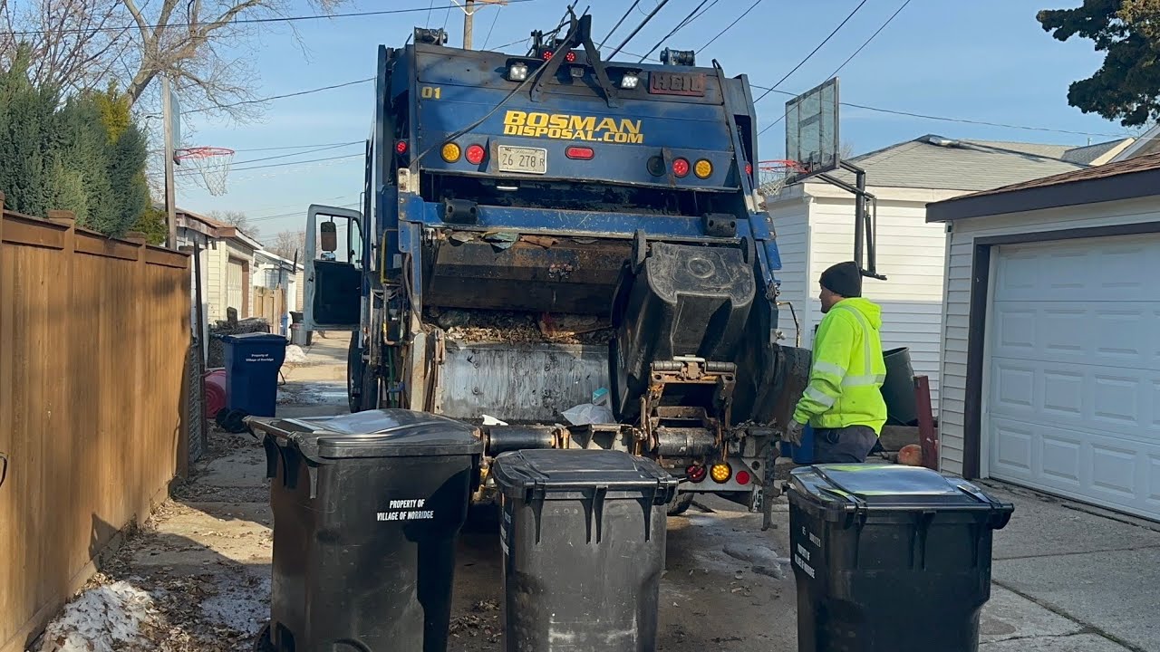 Blue Bosman Disposal International Heil 5000 Rear Loader Garbage Truck Packing Snowy Alley Trash