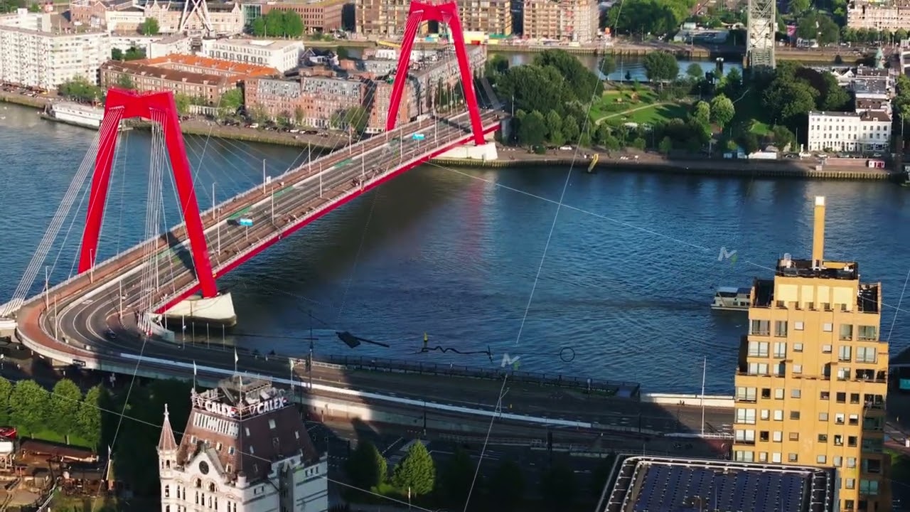 Vibrant Willemsbrug bridge over Nieuwe Maas, modern architecture, and scenic waterways of Rotterdam