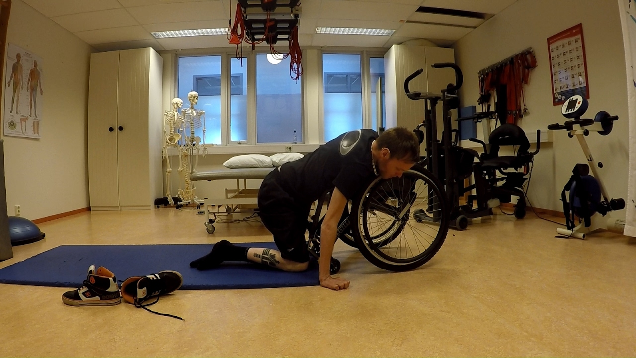 Quadriplegic floor to wheelchair transer