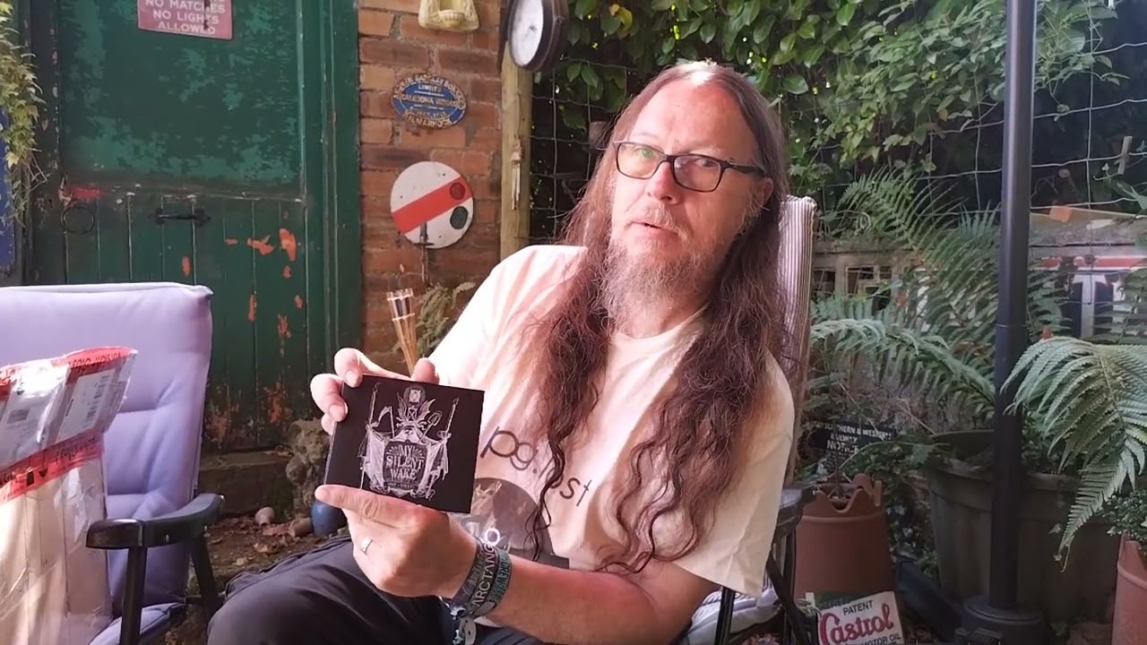 Opening the new MSW compilation album in the garden.