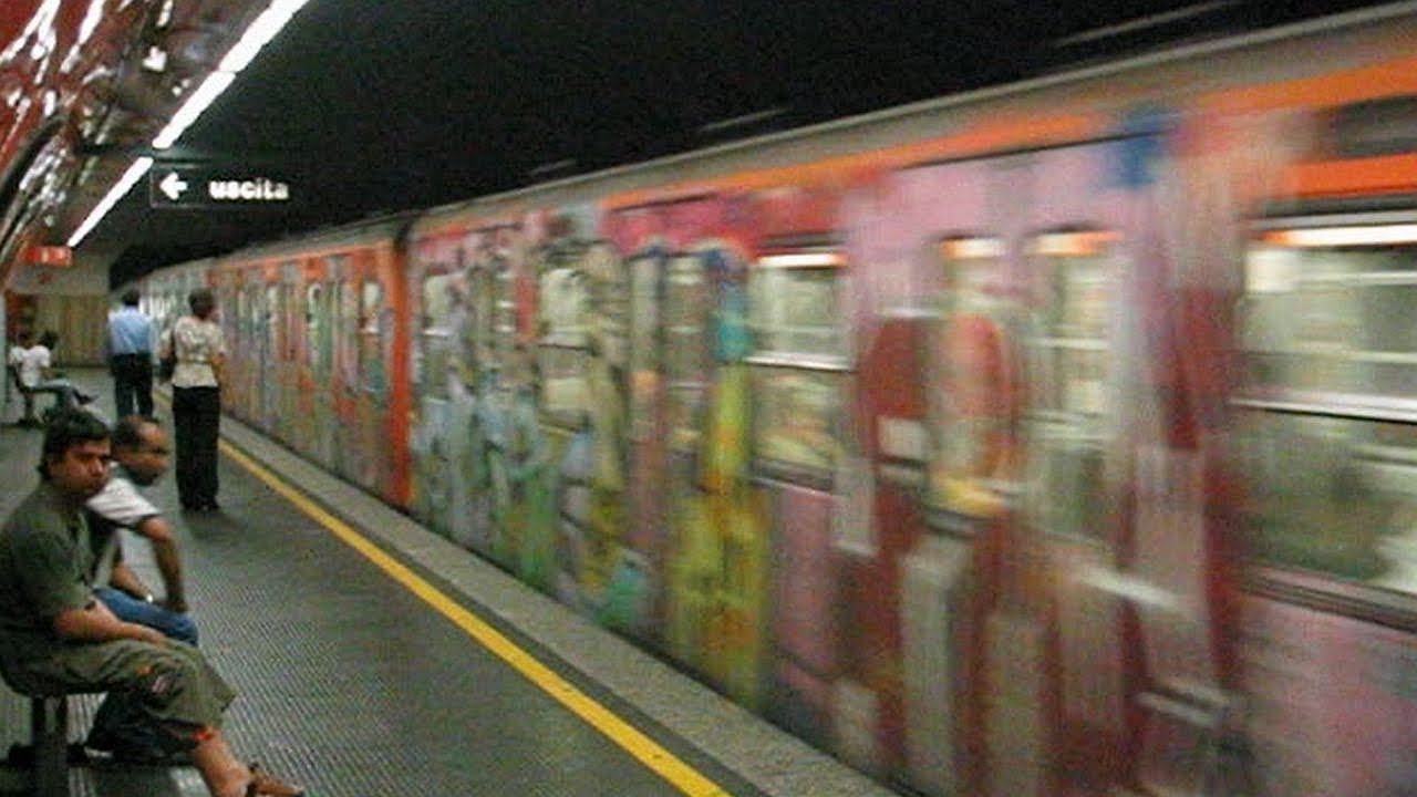 Italy: Rome Metro/Subway, graffiti covered train at Vittorio Emanuele station on Line A