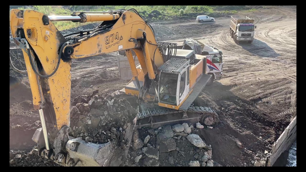 Liebherr 974 Excavator Loading Mercedes & MAN Trucks - Ascon ltd