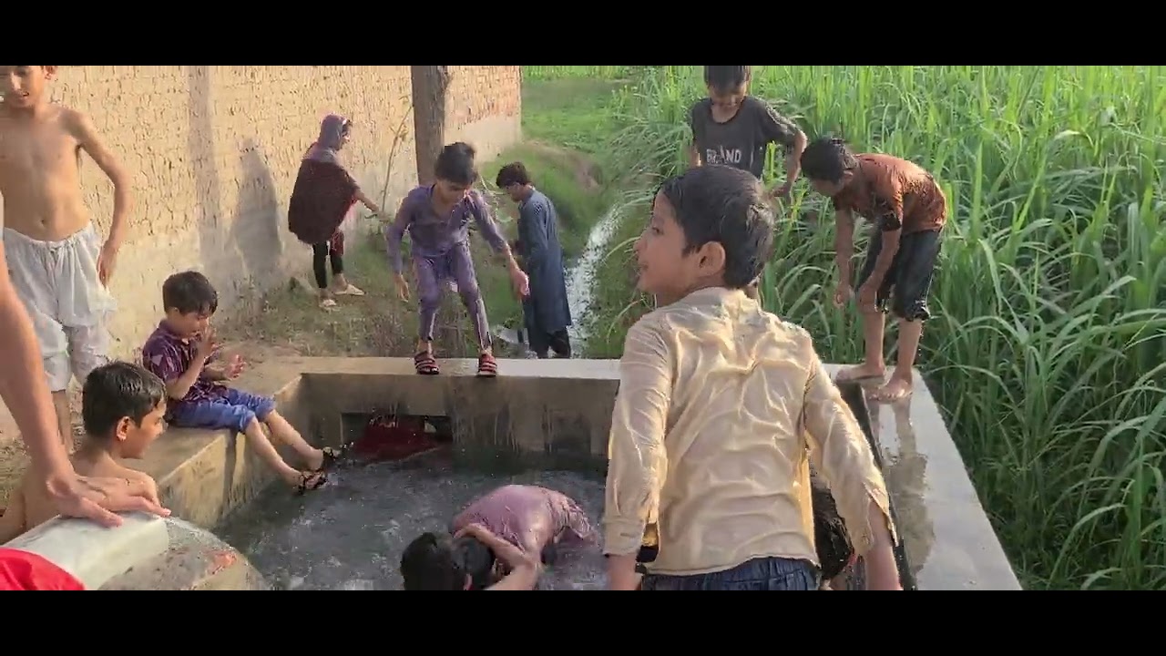 swimming  in tubewell water pool | tubwell water fun by village boys | swimming pool | village life