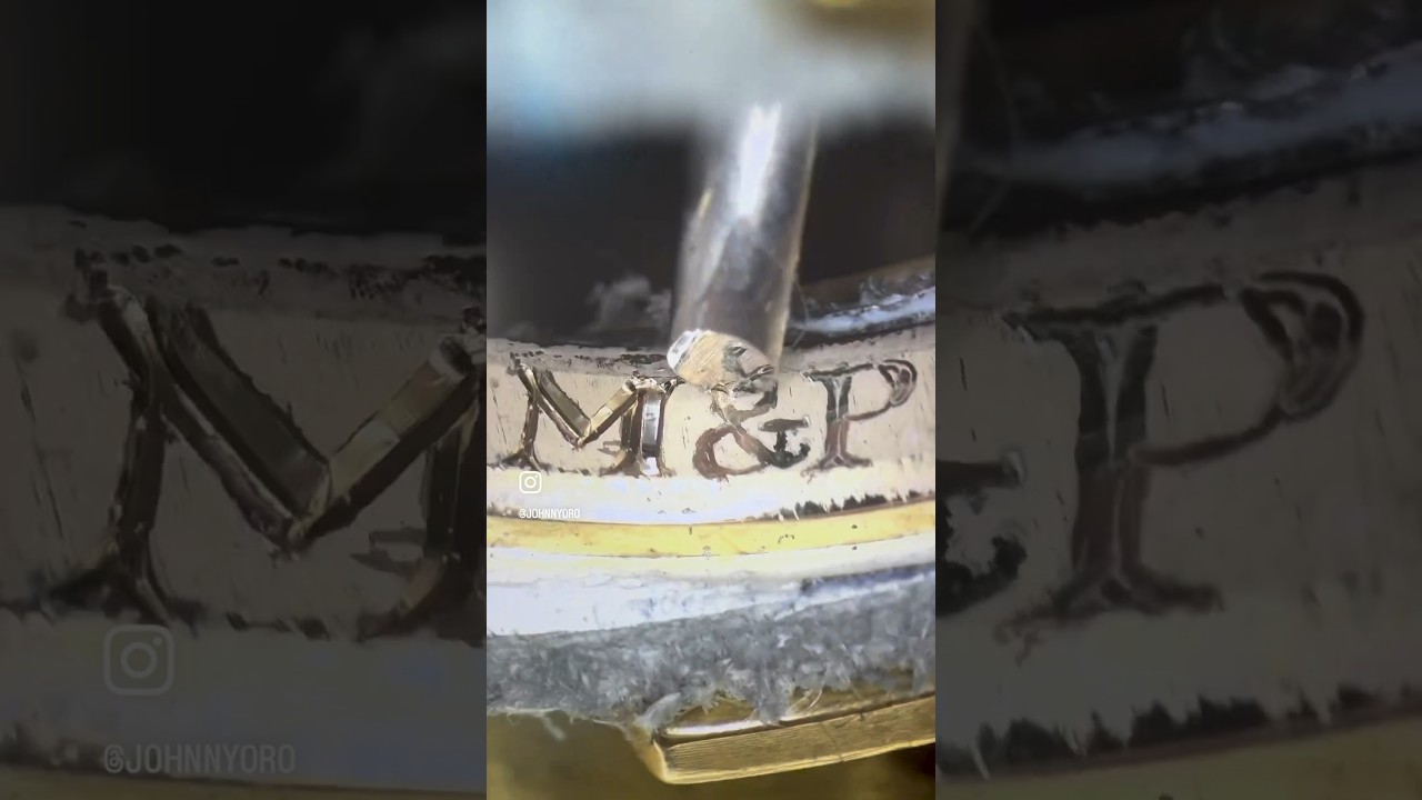 Hand engraving 2mm letters inside of a gold