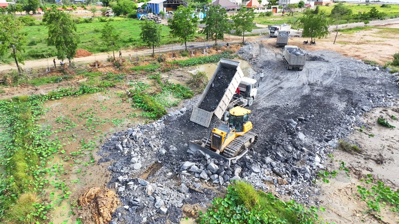 Amazing!! The project to clear the lake of rocks with bulldozers and many heavy trucks