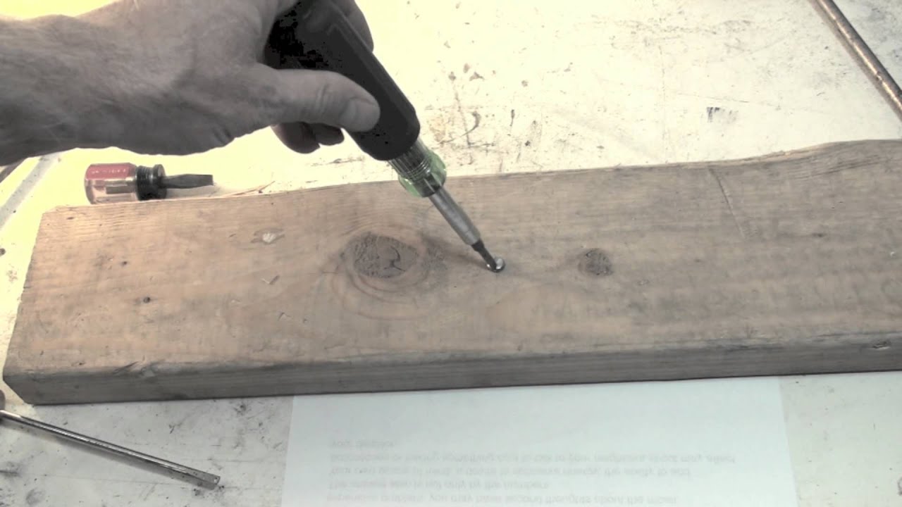 A demonstration of how the slot head screw driver should be used