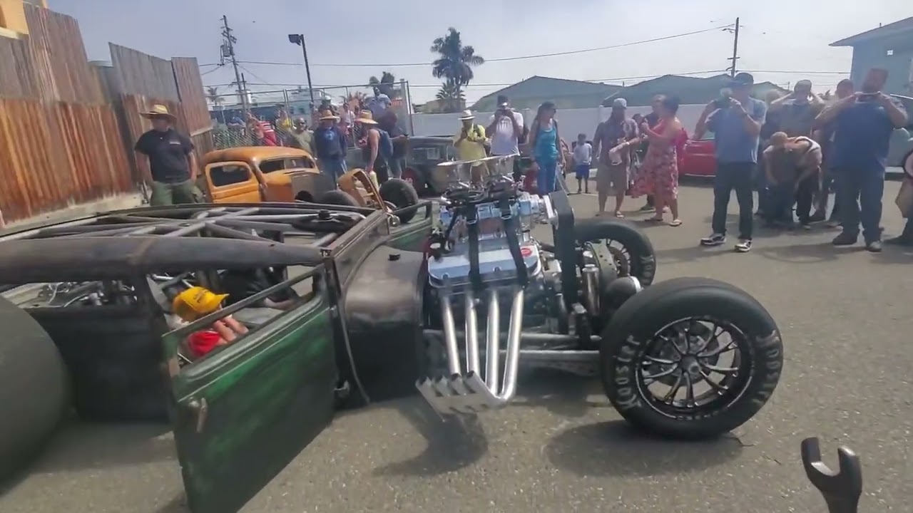 Blown big block Chevy in a 29 ModelA . My little buddy Waylon asked me if I could start it for him .