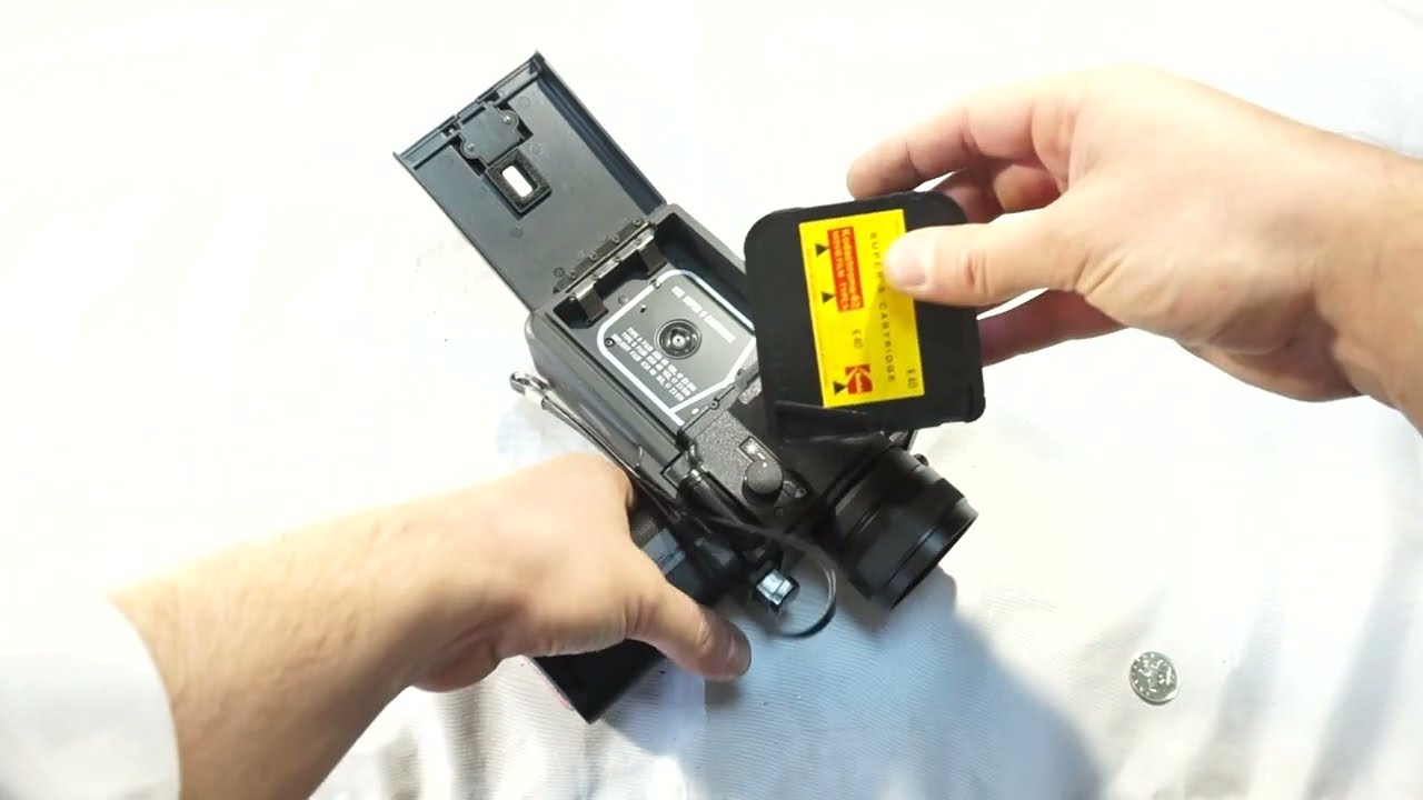 Sankyo EM 60 XL loading Super 8 film and batteries on Super 8 camera Sankyo EM-60XL + free shipping