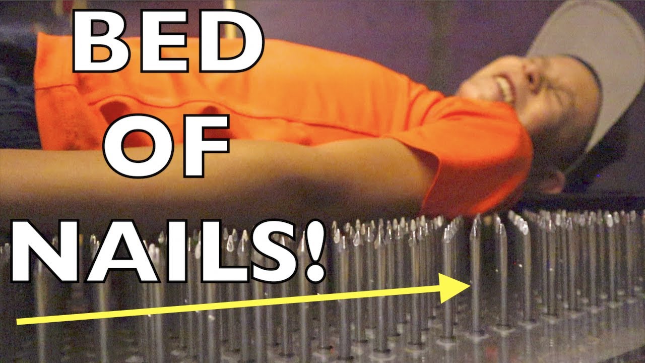 😱LAYING ON A BED OF NAILS!