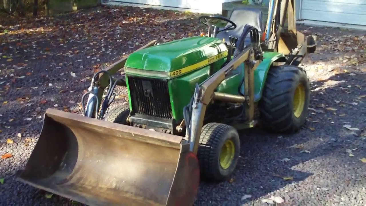 1976 John Deere 400 with Brantley MFG. Co. Front-end Loader and Backhoe attachments.