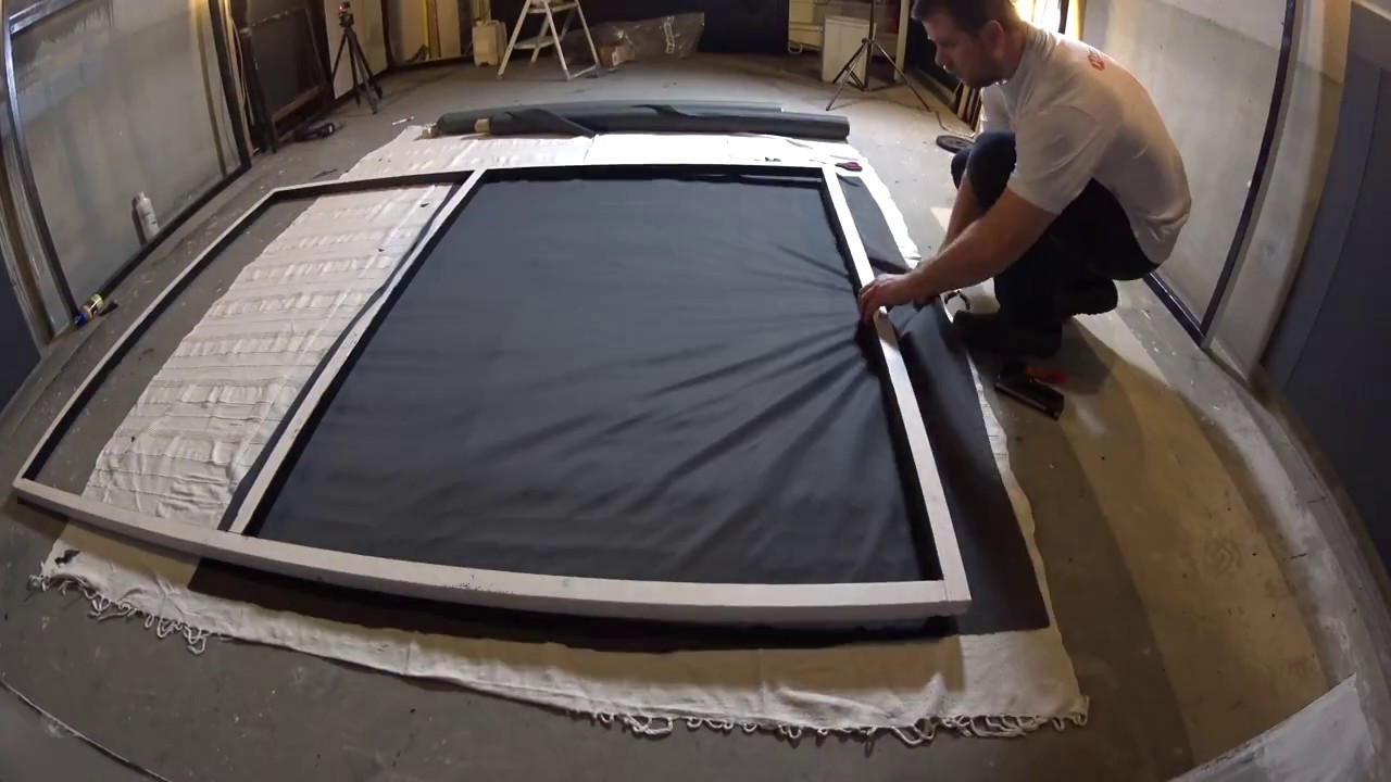 Covering home theater walls with acoustically transparent speaker fabric