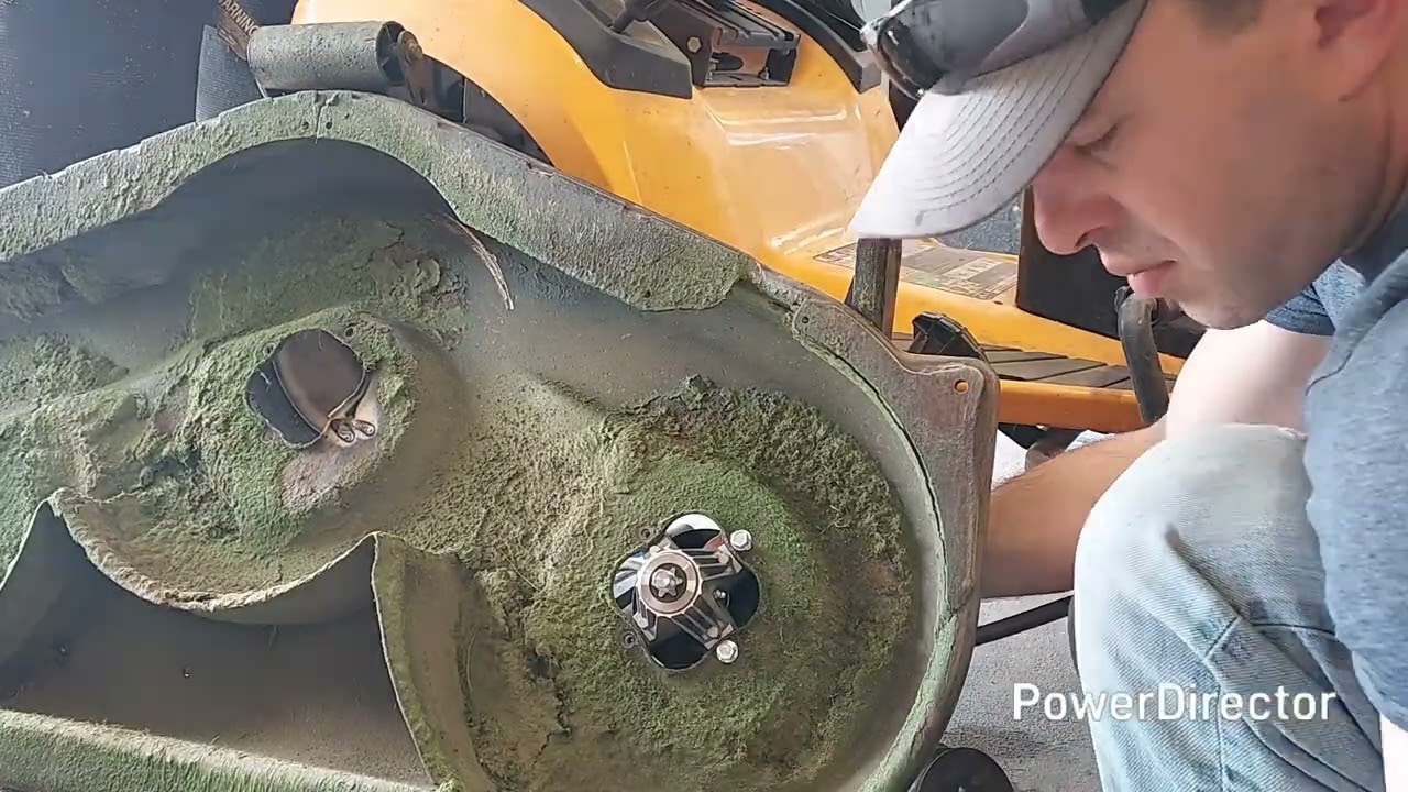 HOW TO rebuild or repair a lawn mower, mower deck. Replacing hubs, blades, and belt on a cub cadet.