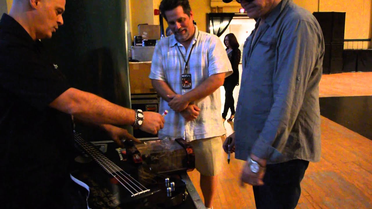 Gene Simmons signing my bass that he played