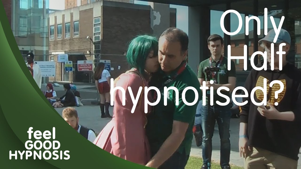 Drops to the ground in hypnosis but only feels half hypnotized by the hypnotist