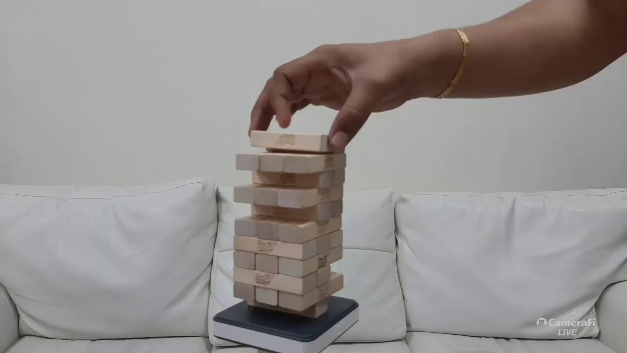 It's weekend, playtime for Akshit with Jenga blocks