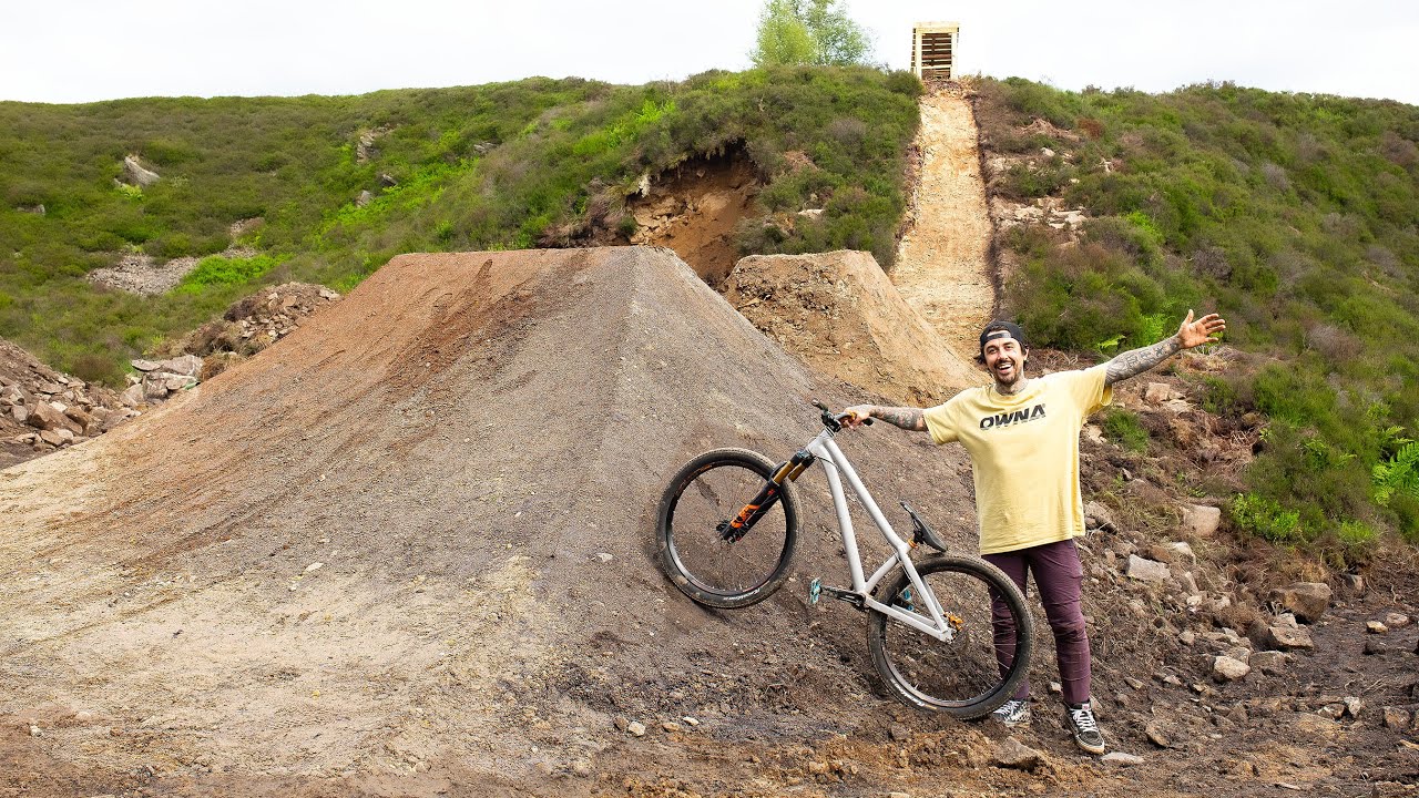 BUILDING MASSIVE DIRT JUMPS IN A HUGE ABANDONED QUARRY! - BUILD & TEST RIDE!