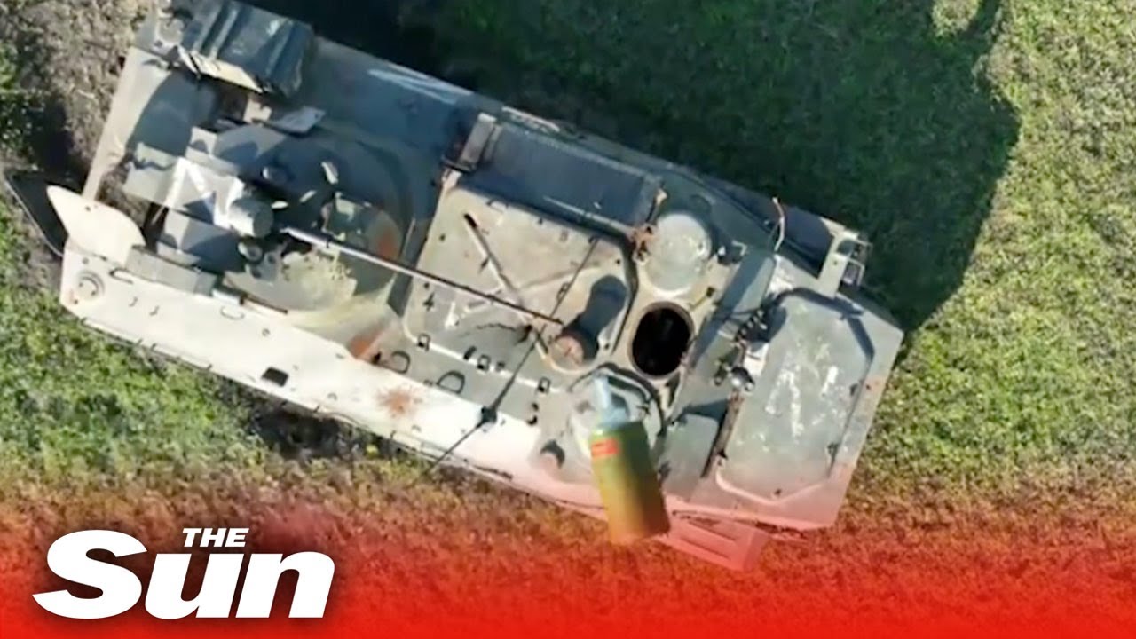 Russian tank explodes as Ukrainian drone drops bomb into open hatch