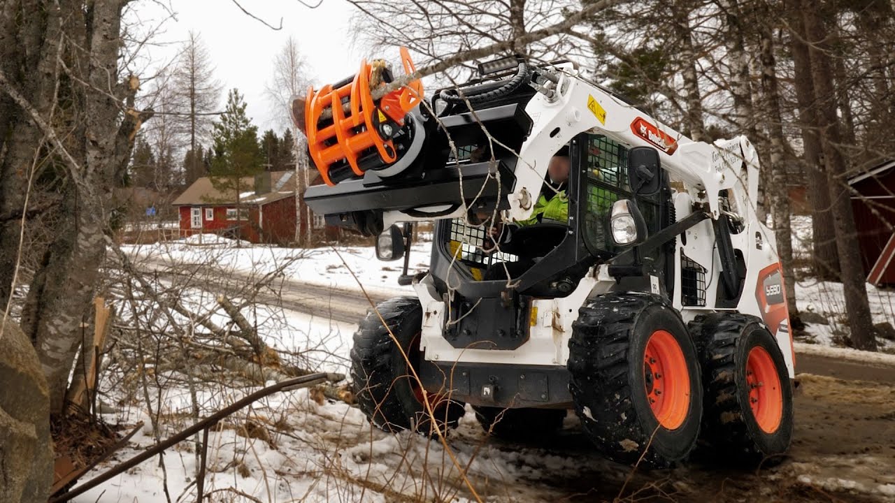 KXZ210 Rotating Tree Shear on a Bobcat Skid-steer Loader
