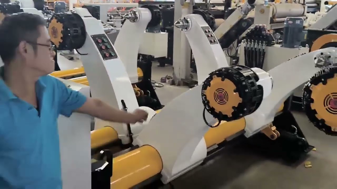 Hydraulic shaftless paper roll stand for sale. WhatsApp 86-18561560798 