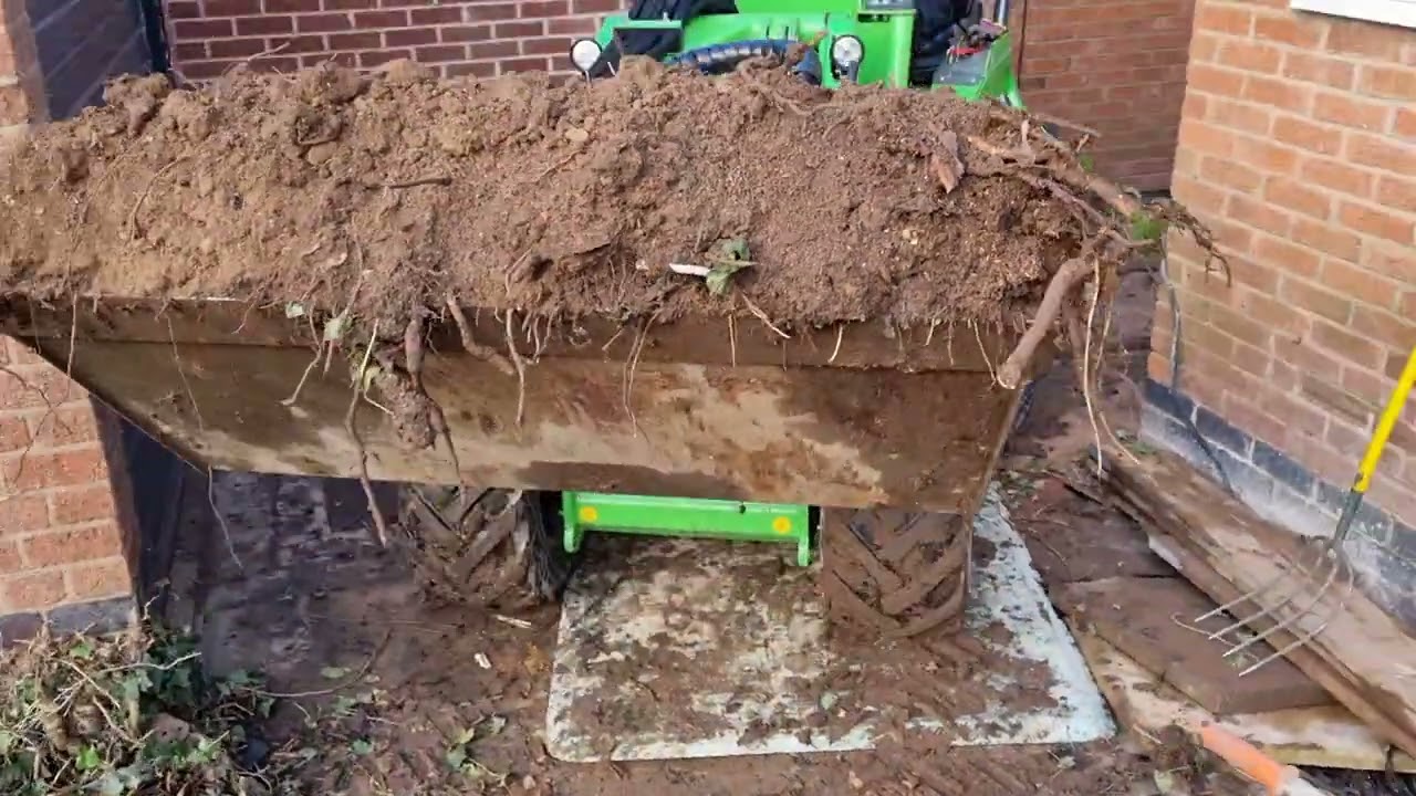 Avant R35 loader moving earth through tight access