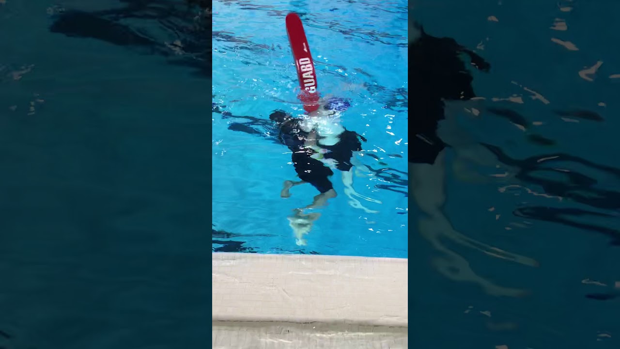 Drowning person submerged in deep water rescue with rescue tube.