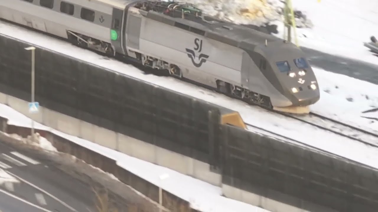 Drone, track work, single track and trains in Lerum. Text below.