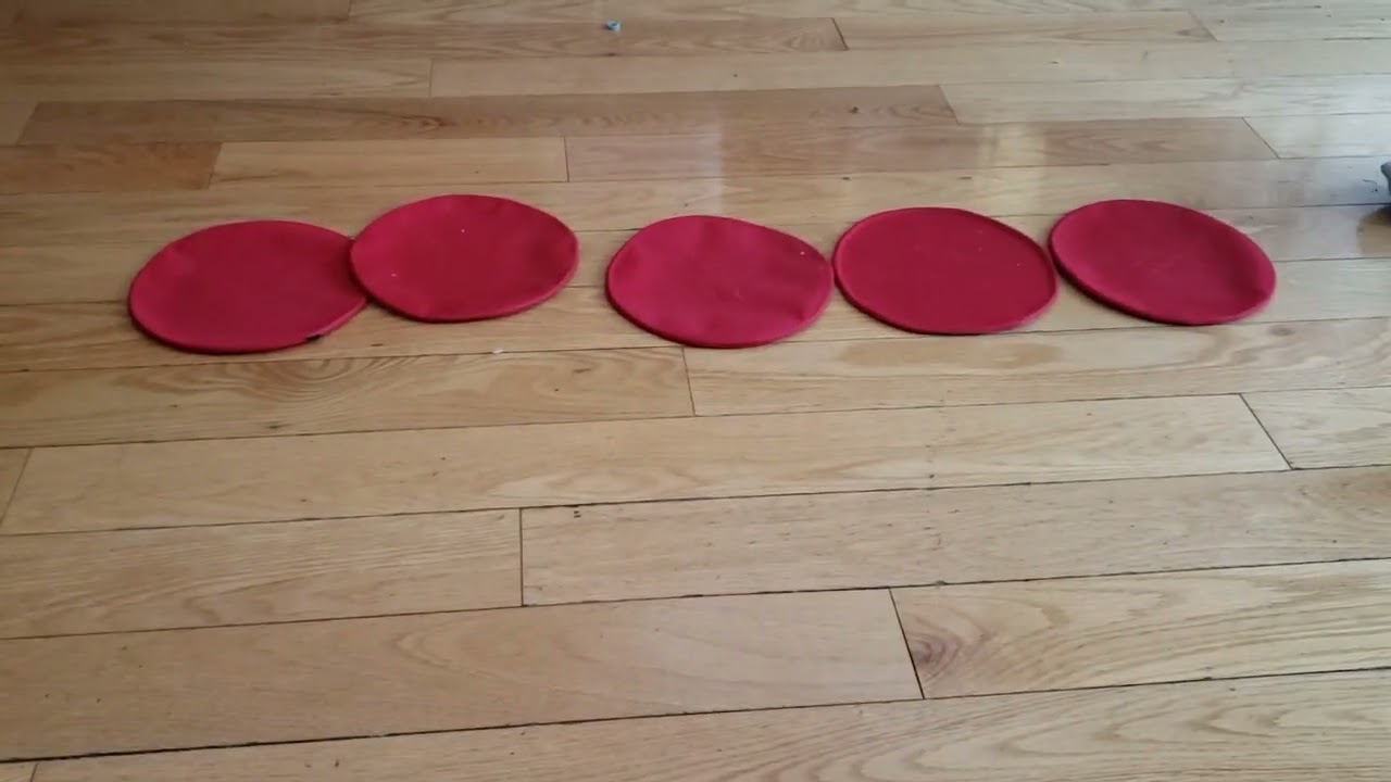 A girl training with ASZORTID Target Shots or Mini Discs single foot speed drill