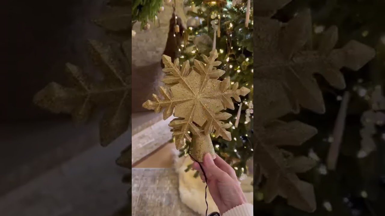 Create instant holiday magic with this moving light show tree topper
