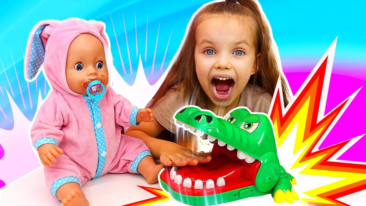 Maya knows how important it is to brush her teeth and tells her baby doll about it.