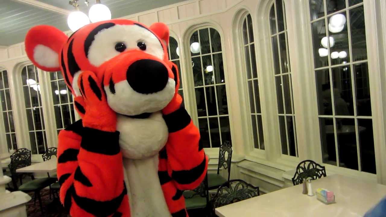 Tommy Des Brisay bounces with Tigger aand tells him a story at Crystal Palace in Magic Kingdom