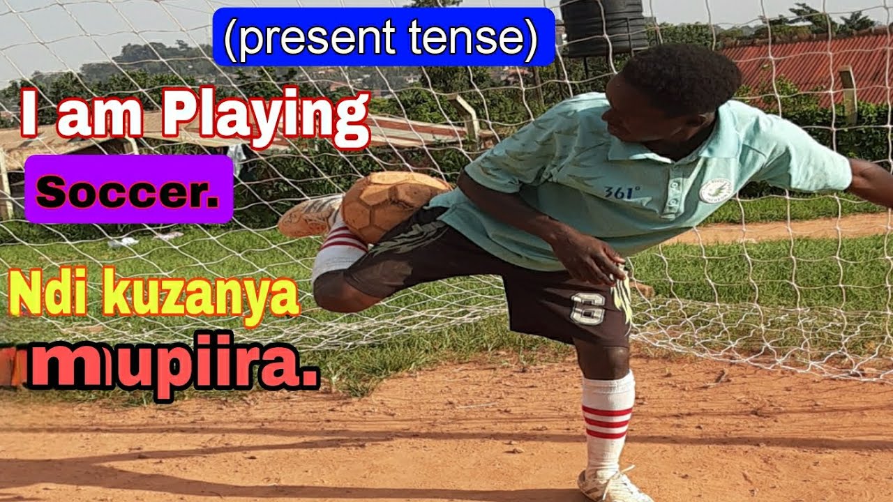 I am Playing soccer| present tense example. Nzanya Mupiira.😂