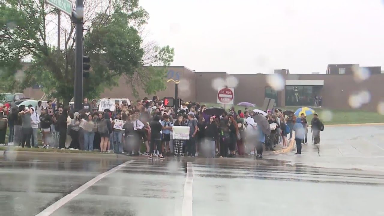 Dozens of Olathe South High School students walk out to protest reported race issues at the school