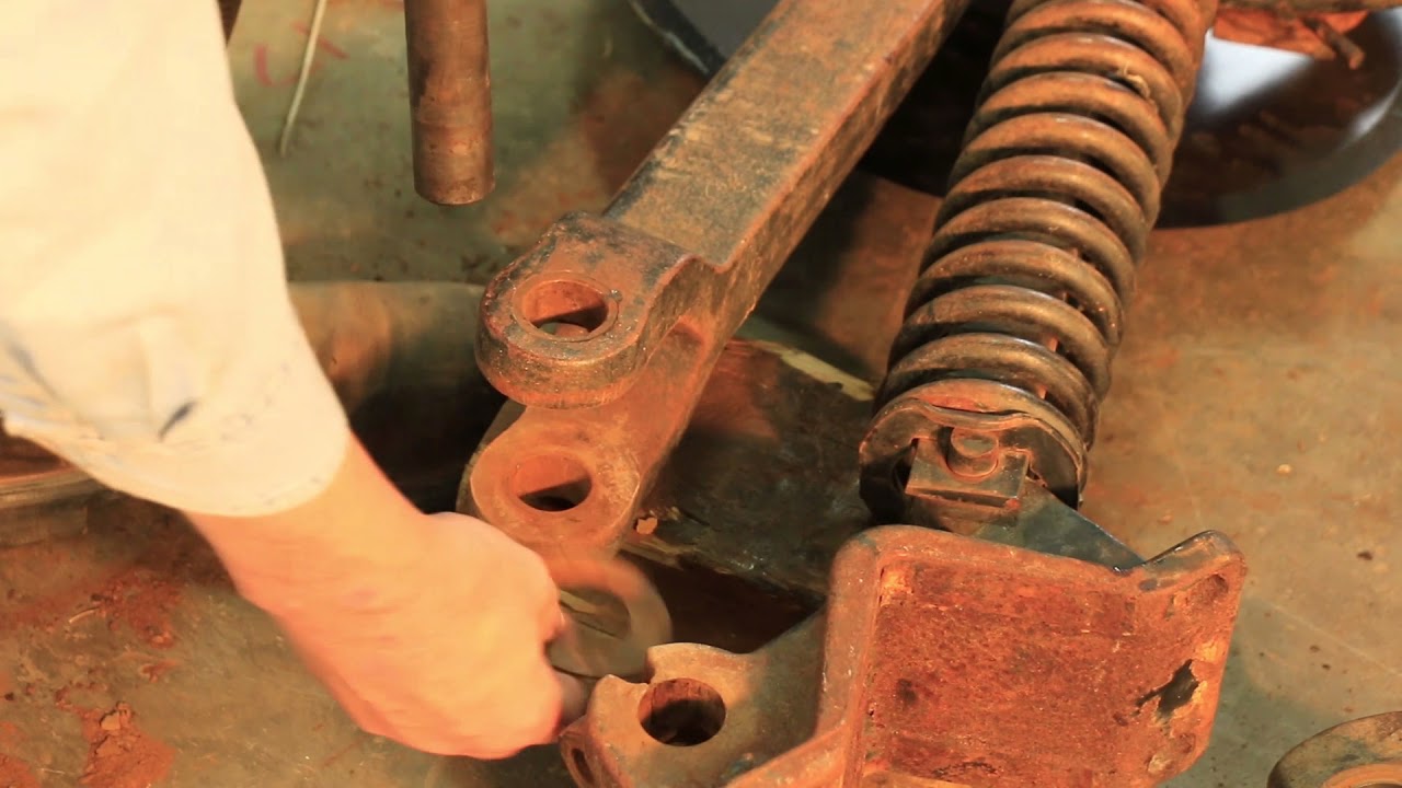 Needham Ag - Installing MAIN OPENER ARM PINS AND BUSHINGS on John Deere Openers.