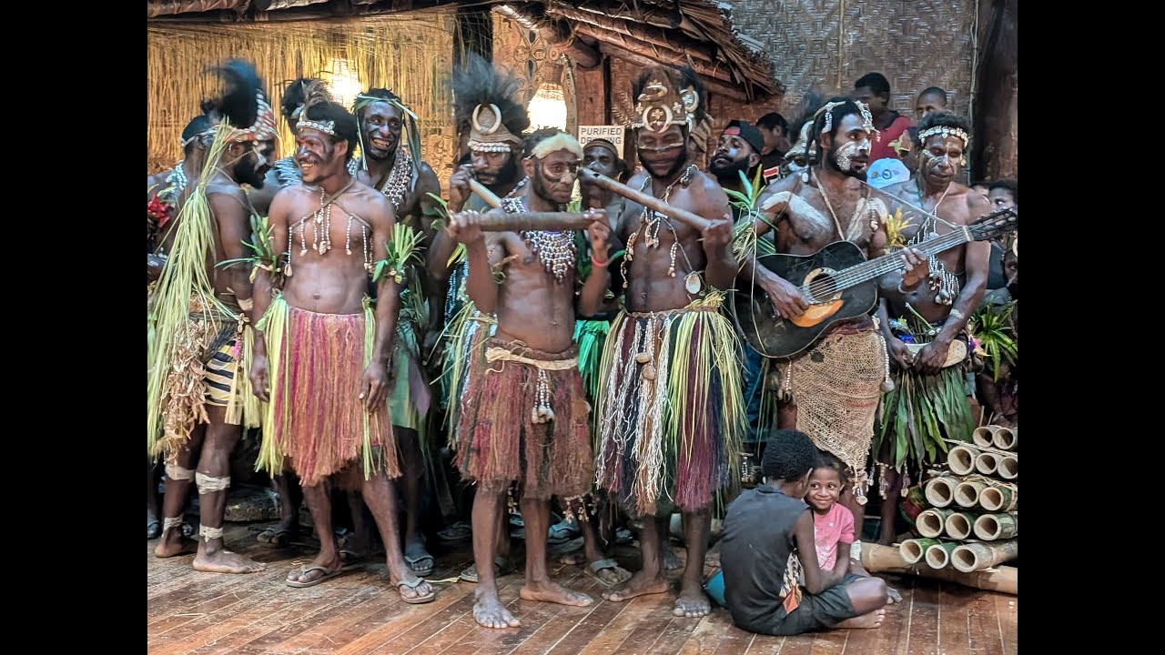 Karawari Singers with Rambunctious Rattan Tumbuan Mask Dancer, Sepik Region, Papua New Guinea