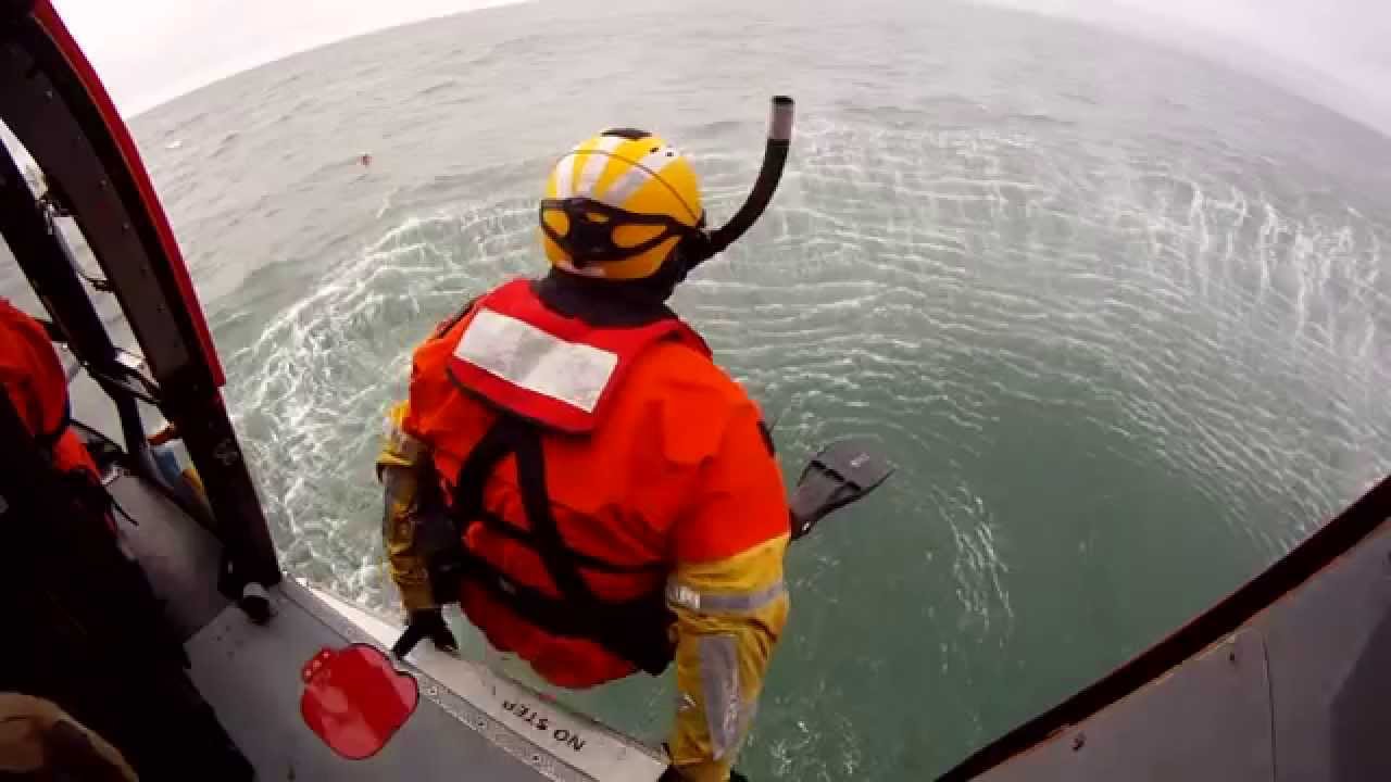 US Coast Guard Rescue Swimmers Jumping from a helicopter