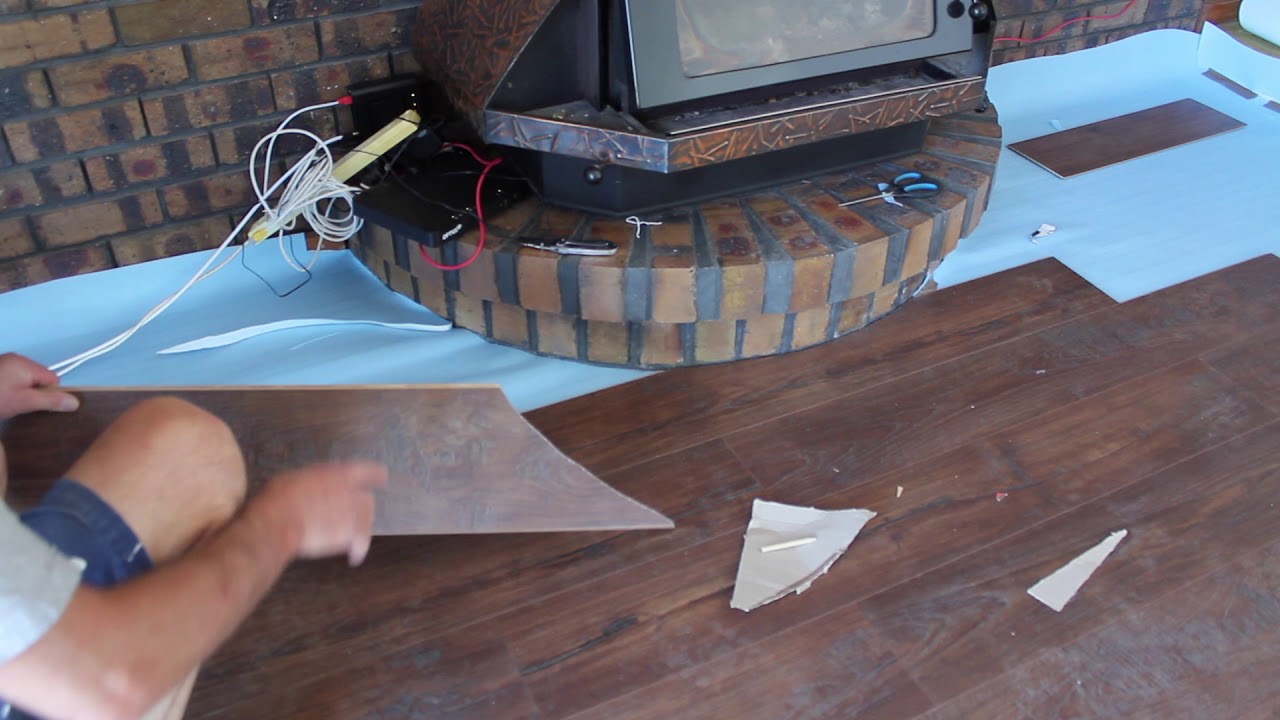 Cutting curves in timber laminate floorboards How to cut floorboards around a curved fireplace.