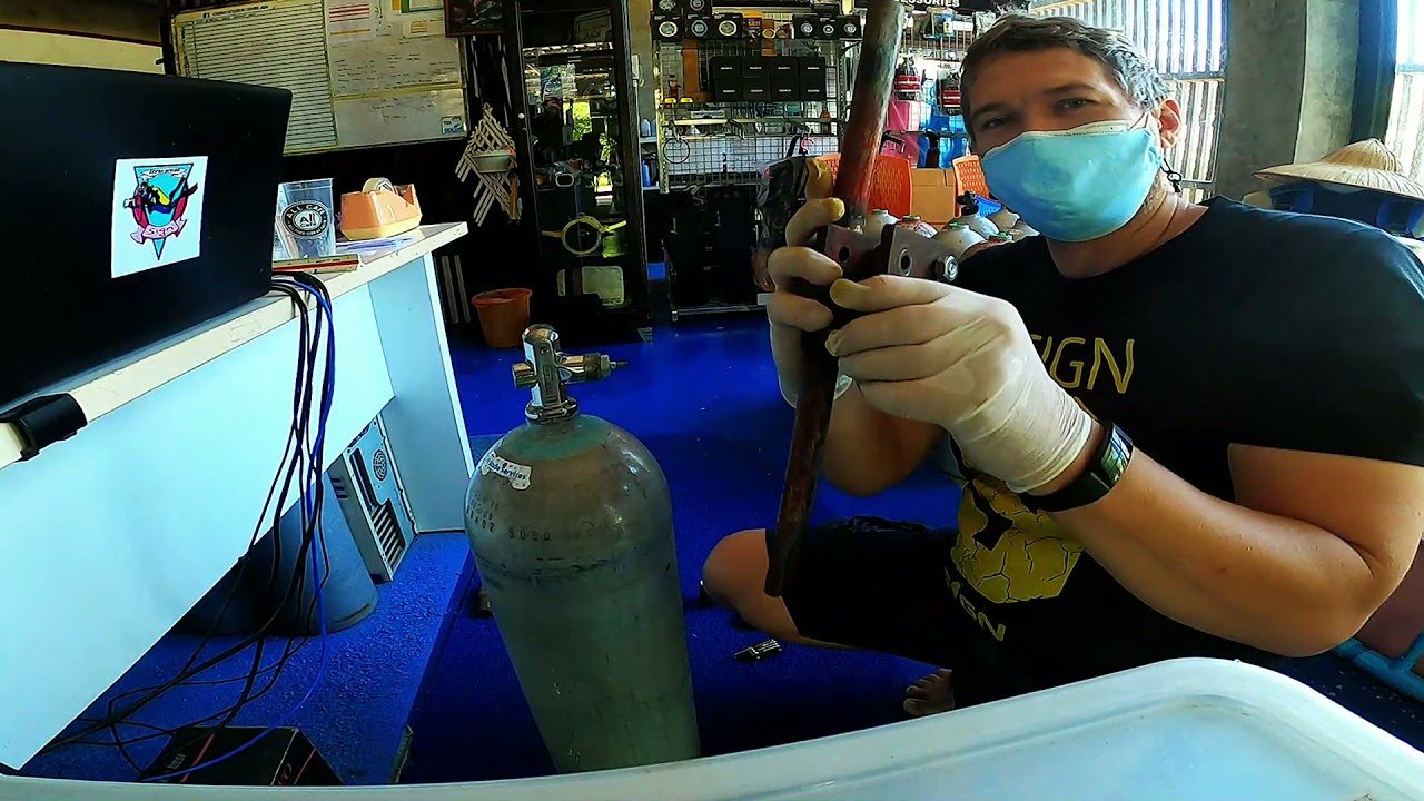 Removing valve from scuba tank