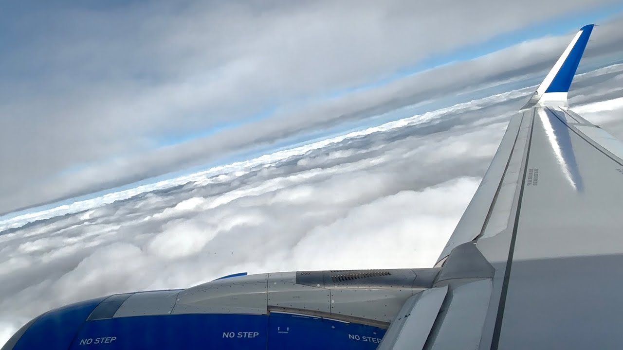 Breaking through clouds takeoff out of Chicago - United Airlines - Airbus A321 NEO