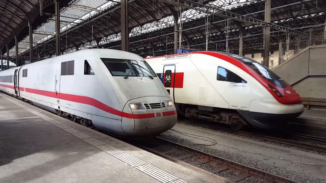ICN Zug RABDe500 der SBB und ICE1 der DB verlassen nacheinander den Bahnhof Basel, treni, trains