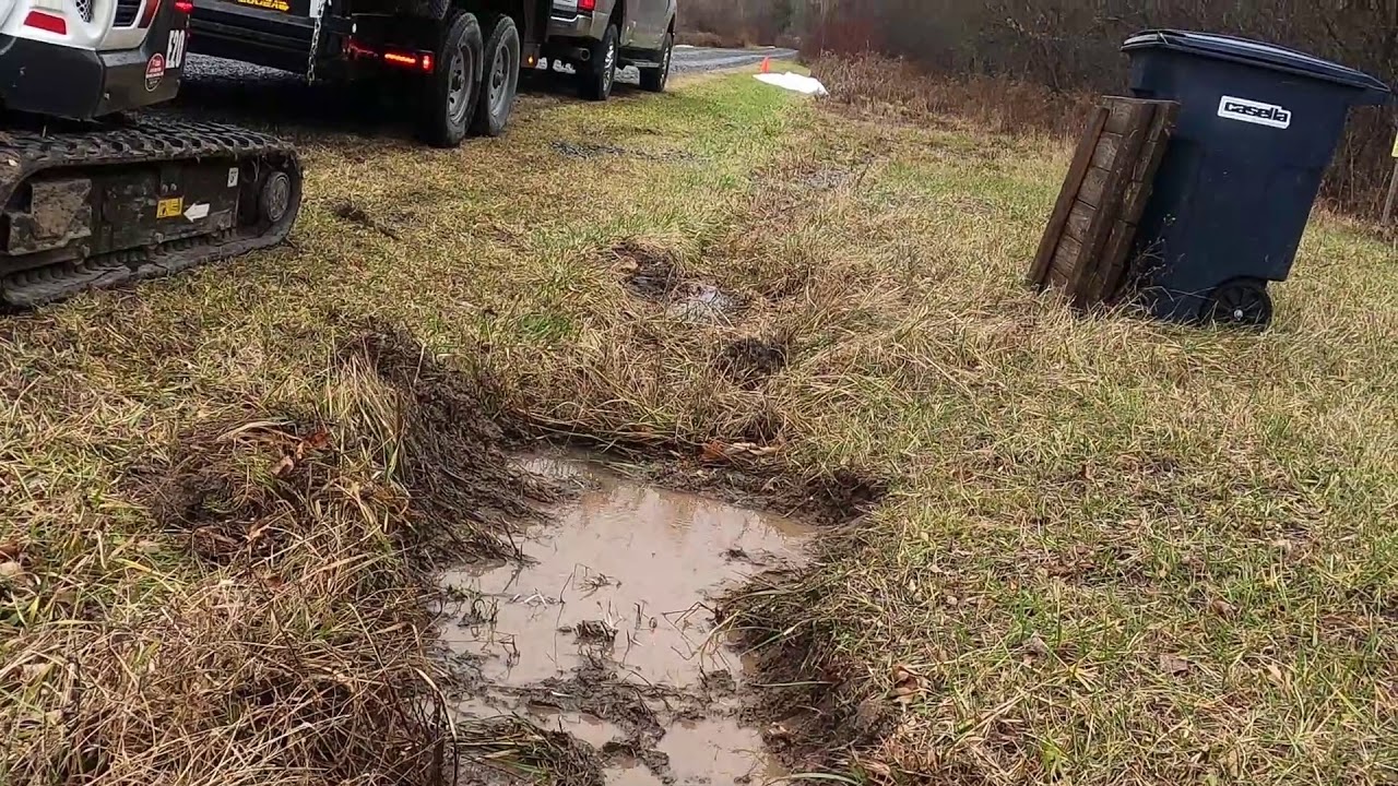 Bobcat E20 Digging Ditch