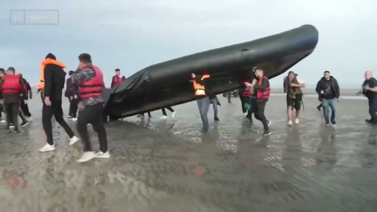 French police slash an illegal migrant boat stopping them coming to Britain.