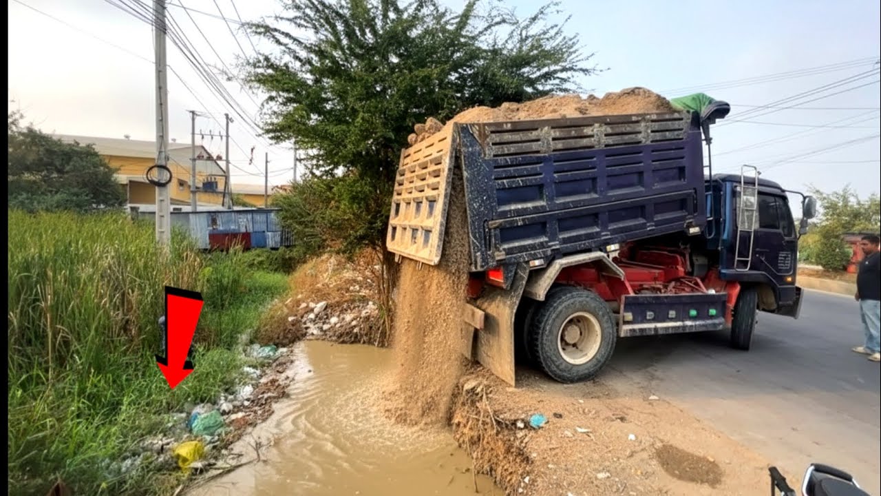 New project landfill by dump truck 5T unloading soil with skill operator bulldozer working push fill